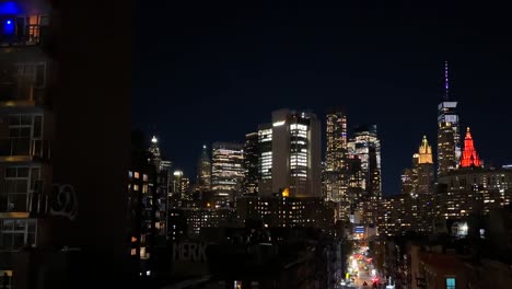 manhattan skyline and night traffic, lights on skyscrapers and streets, new york usa