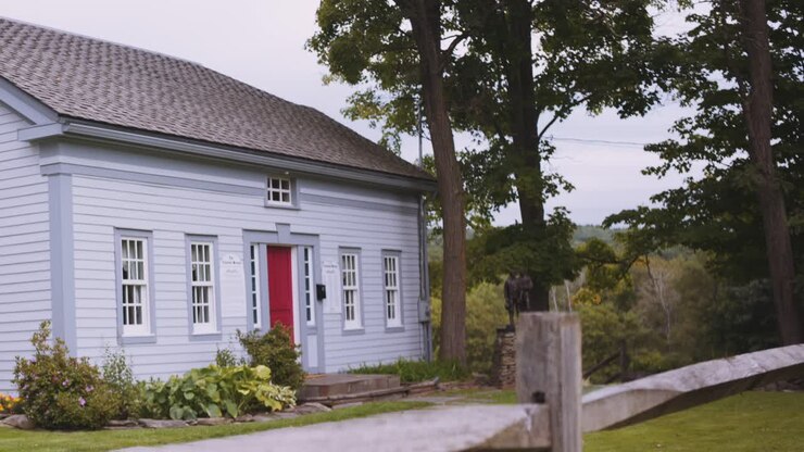 focus pull from fence to the original Home of the Knights, Joseph Sr and Newel Knight and the place of the first branch of the church of Christ, Mormons located in Colesville, New York Bainbridge