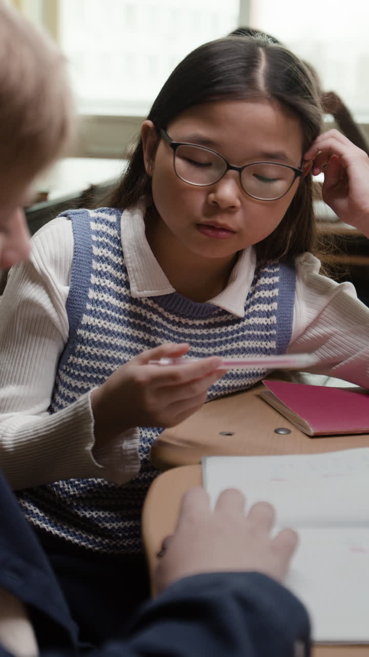 Students Collaborating and Studying in a Classroom