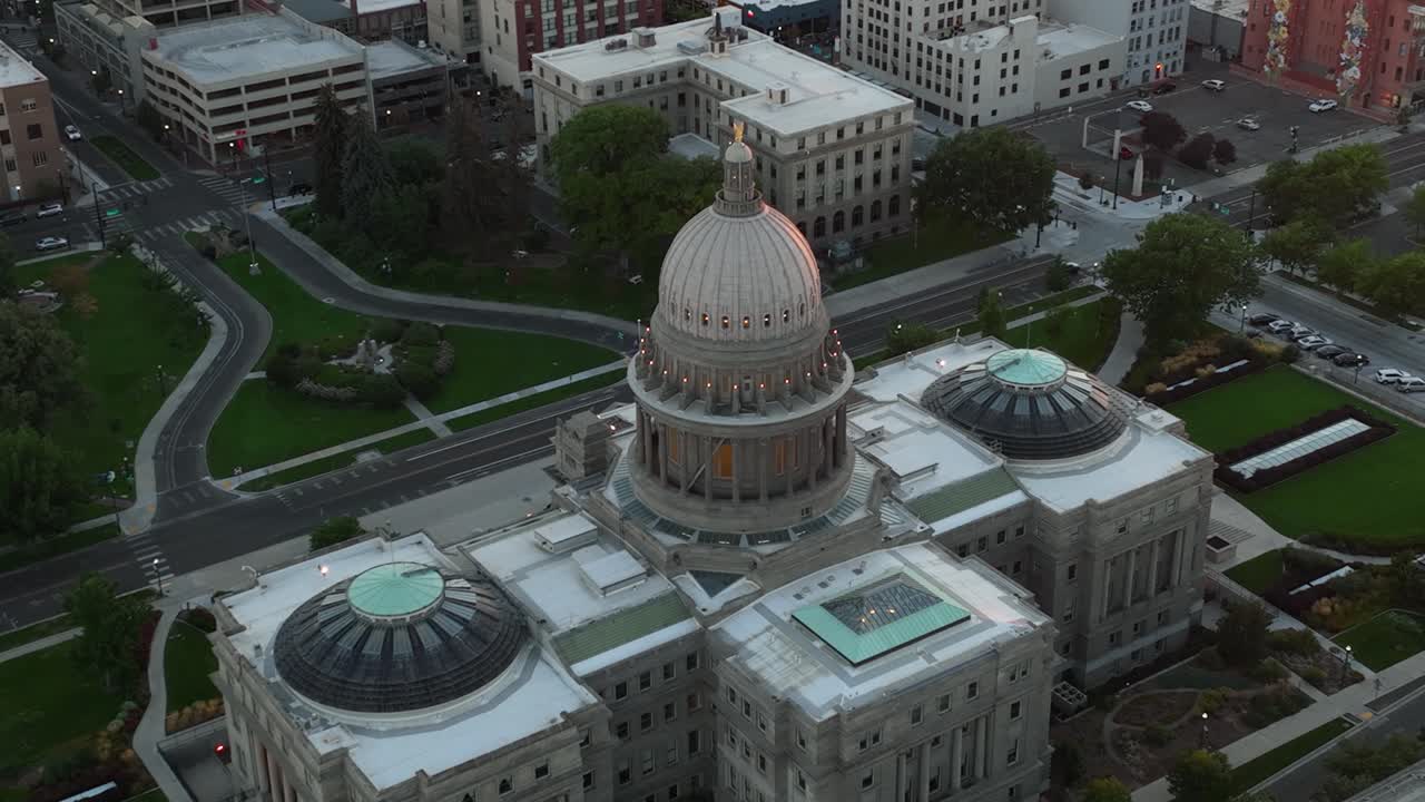 Close aerial of Idaho State Capitol Building at dusk in downtown Boise