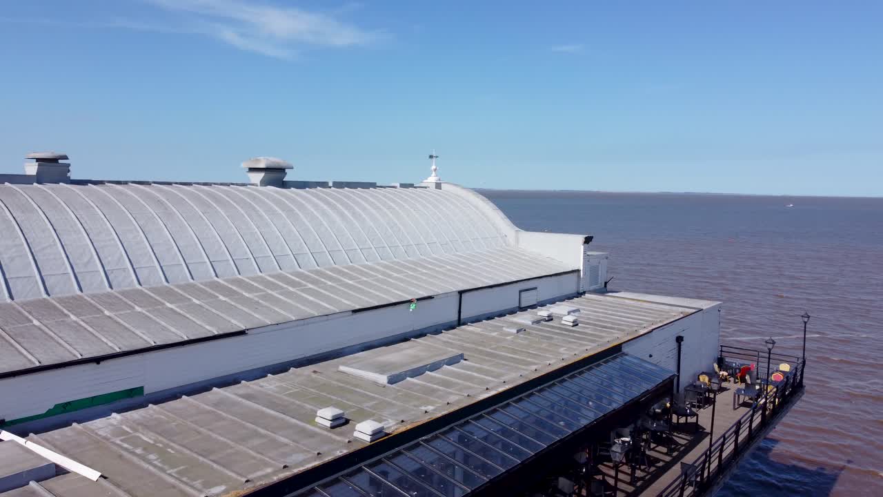 Aerial view rising over Papas fish and chips shop on Grimsby pier landmark seaside visitor attraction