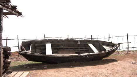 old wooden boat on a rural shore
