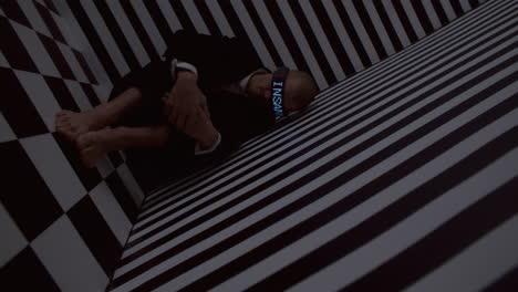 man in vr headset in optical illusion room