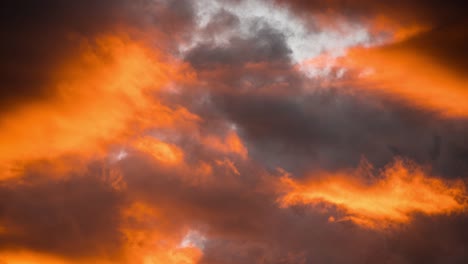 sunset time lapse with orange and blue clouds