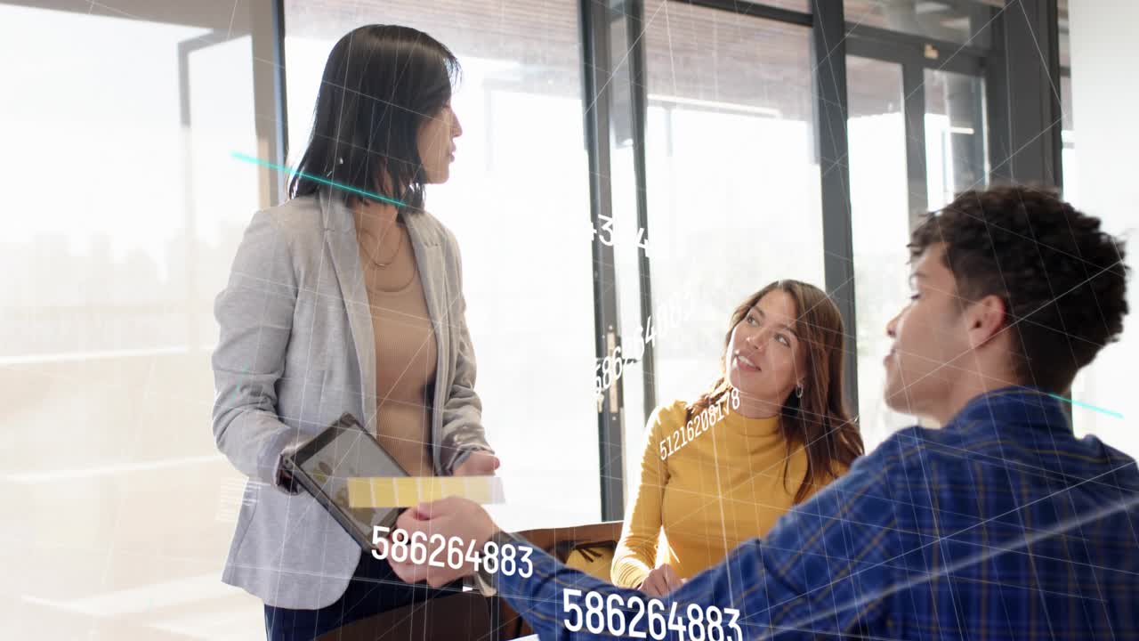 Lead offering tablet gesturing in business numeric overlay mapping while man passing note for input