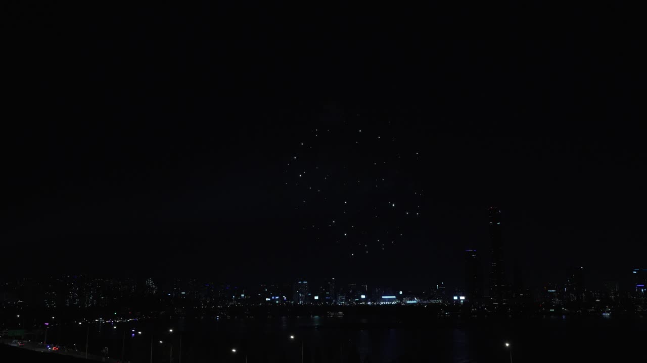 Firework display in Night City Skyline During Seoul International Firework Festival at the Yeouido Han River 2024 - aerial View