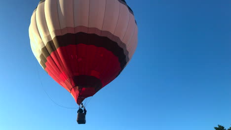 colorful hot air balloon floats away after launch