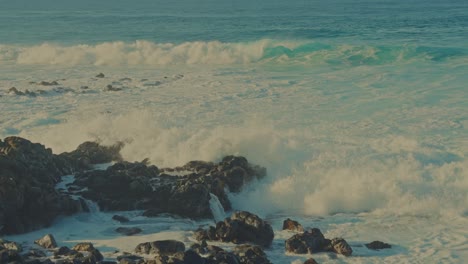 the power of the pacific beautiful aqua ocean waves plow into the rocky shores of oahu on a beautiful sunny day in hawaii