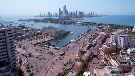 aerial view of a coastal city with modern skyline and historic waterfront