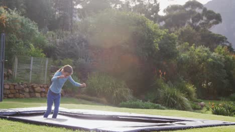 Little-girl-happily-jumping-on-trampoline-4K-4k
