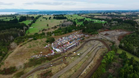 Aerial-View-Over-Motor-Race-On-Muddy-Racetrack-At-Frutillar,-Los-Lagos-Region,-Chile