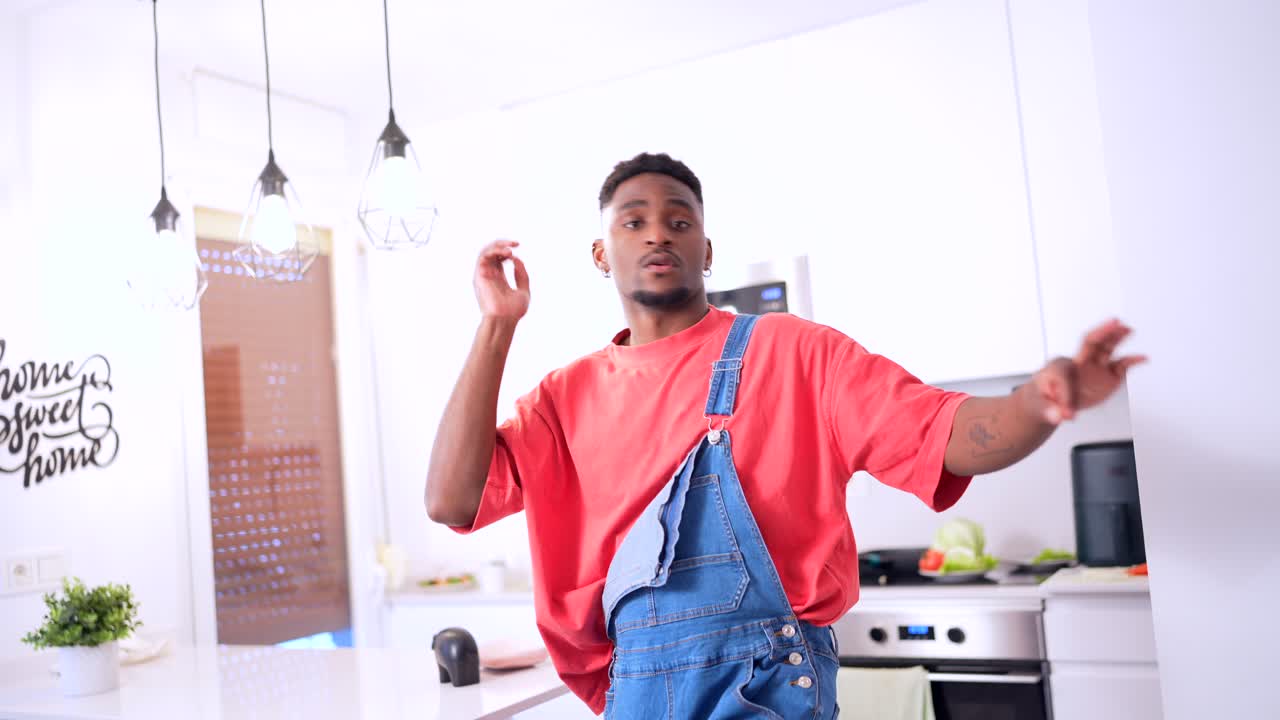 Man in overalls in a modern kitchen