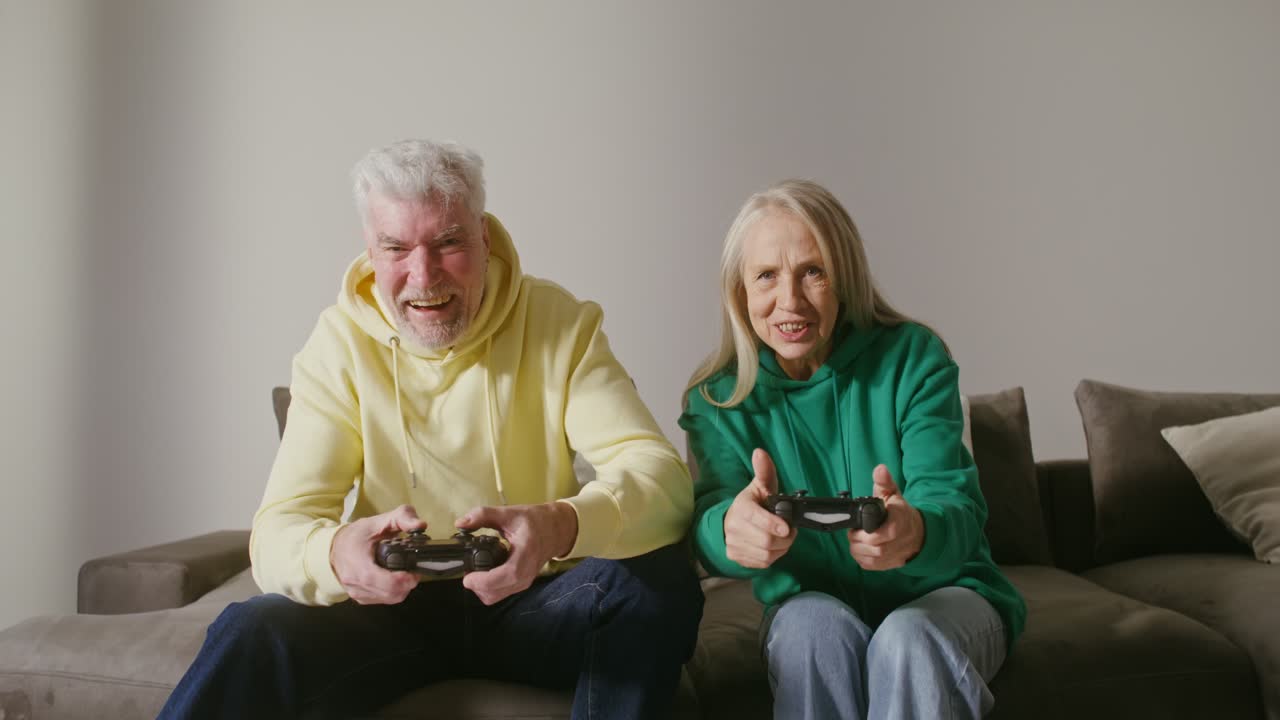 Elderly Couple Enjoying Video Games Together