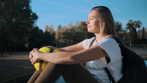 caucasian woman resting outdoors.