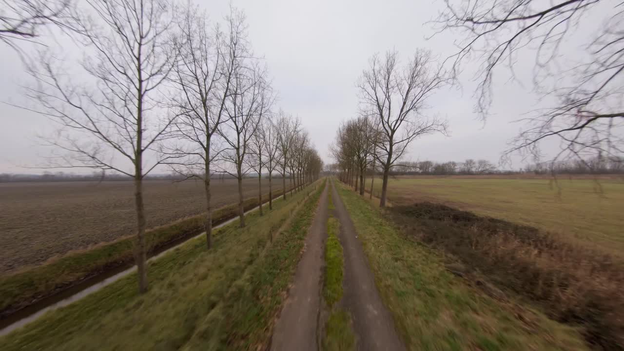 Fast moving above a road on a Dutch dyke during winter