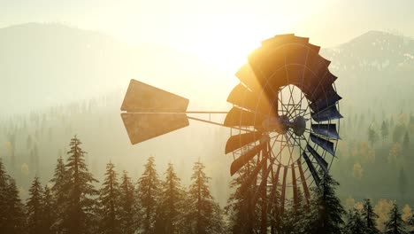 Typical-Old-Windmill-turbine-in-forest-at-sunset