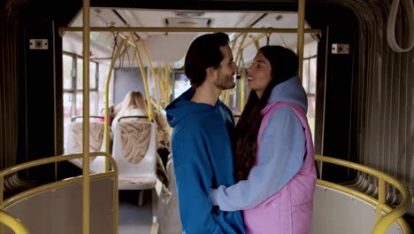 Side-view-of-a-couple-in-the-bus