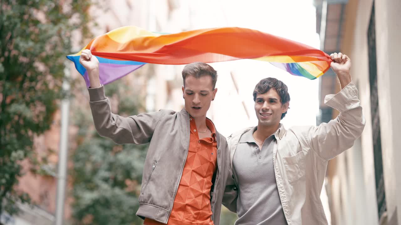 Two Men Celebrating Pride with Rainbow Flag