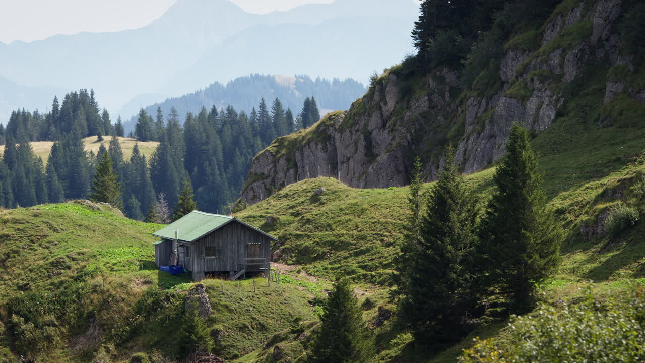 Shot of a mountain hut in the Allgäu in the Alps in Germany on a sunny summer day with a peaceful atmosphere.