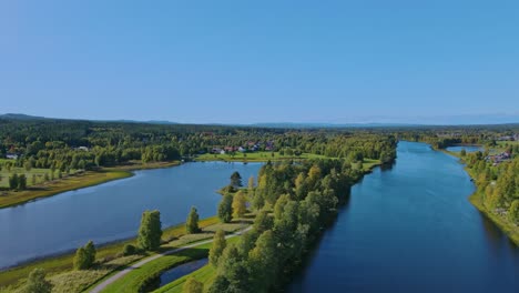 beautiful forest and river landscape in malung, dalarna, sweden - aerial shot