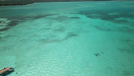 Nylon-Pool-aerial-view-of-a-natural-crystal-clear-swimming-pool-with-a-sandy-bottom