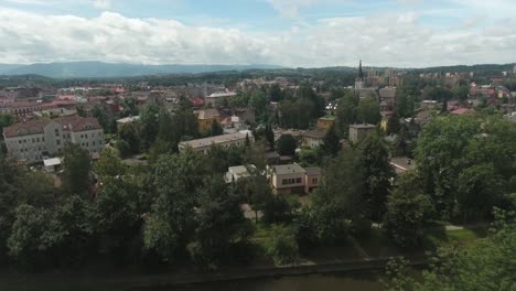 the city center in central europe filled with trees and historic buildings