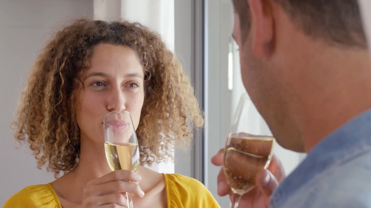 Smiling couple drinking glass of champagne