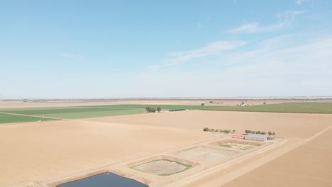 Rising-aerial-view-of-empty-water-holding-pools-in-Southern-California