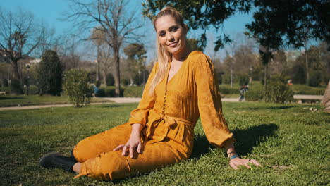 stylish young woman resting in the park outdoors.