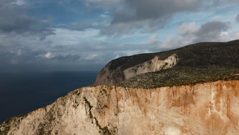 coastal cliffside view with dramatic clouds