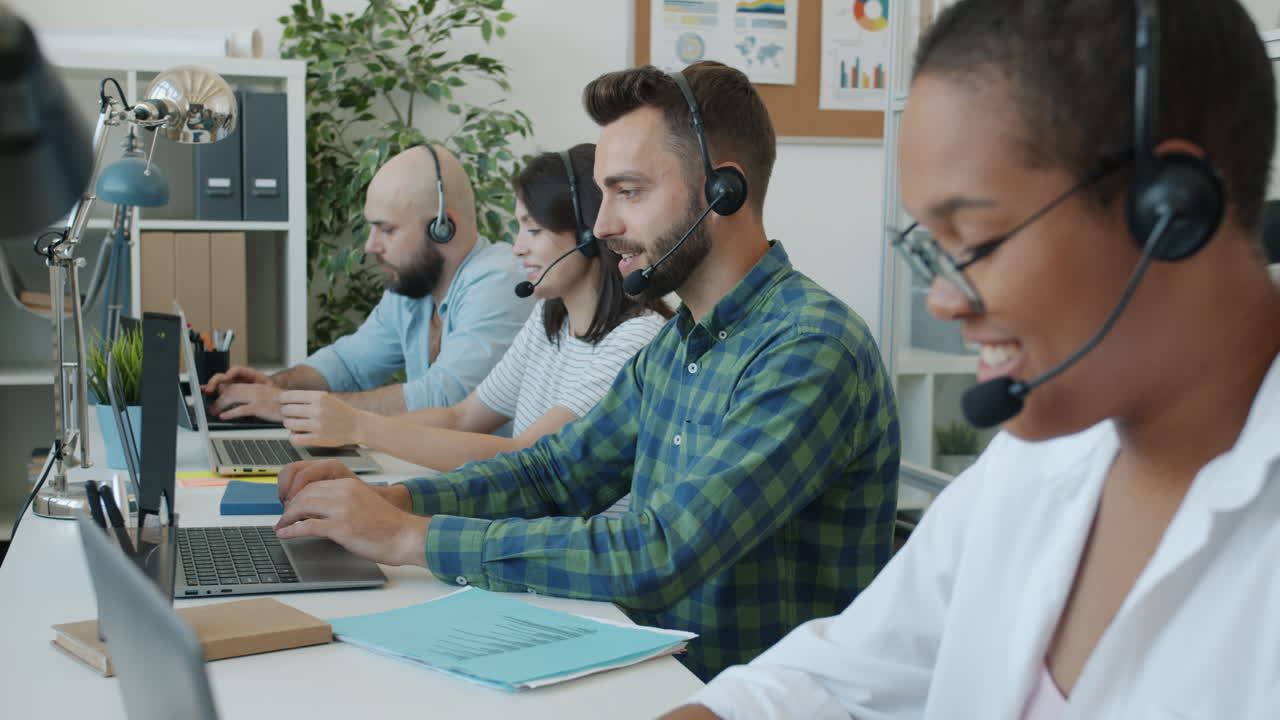 Diverse Call Center Team Working in a Modern Office