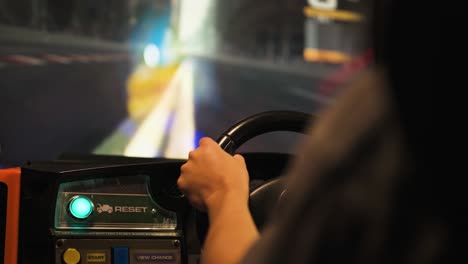 racing car machine in arcade, focusing on the wheels, slow motion