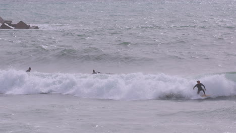 male surfer riding a wave