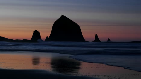 haystack rock silhouette at twilight, cannon beach oregon
