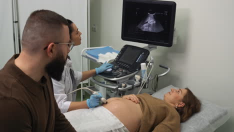 pregnant woman laying on stretcher