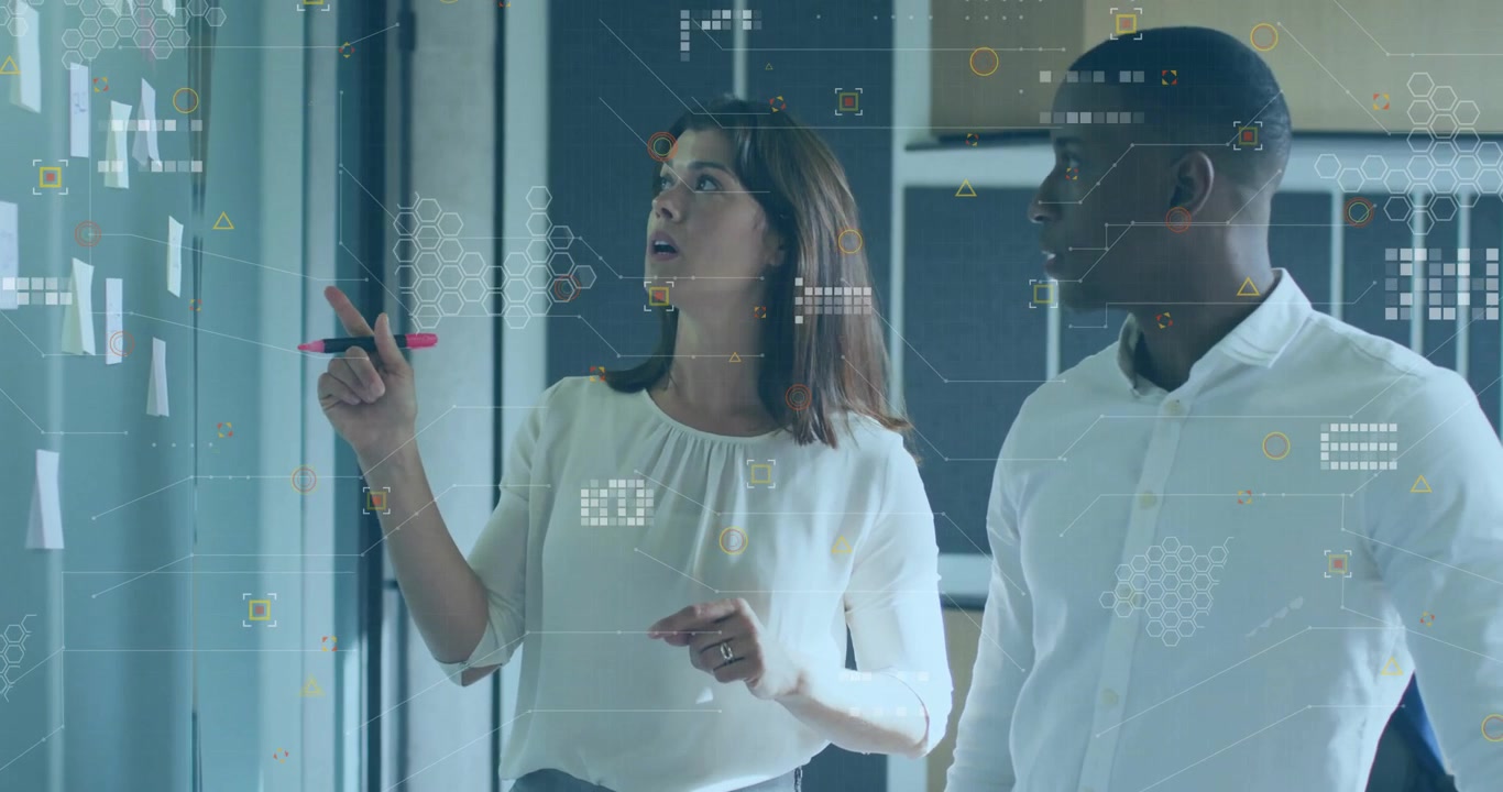 Woman scanning board then picking marker and grouping notes while man nodding in business planning