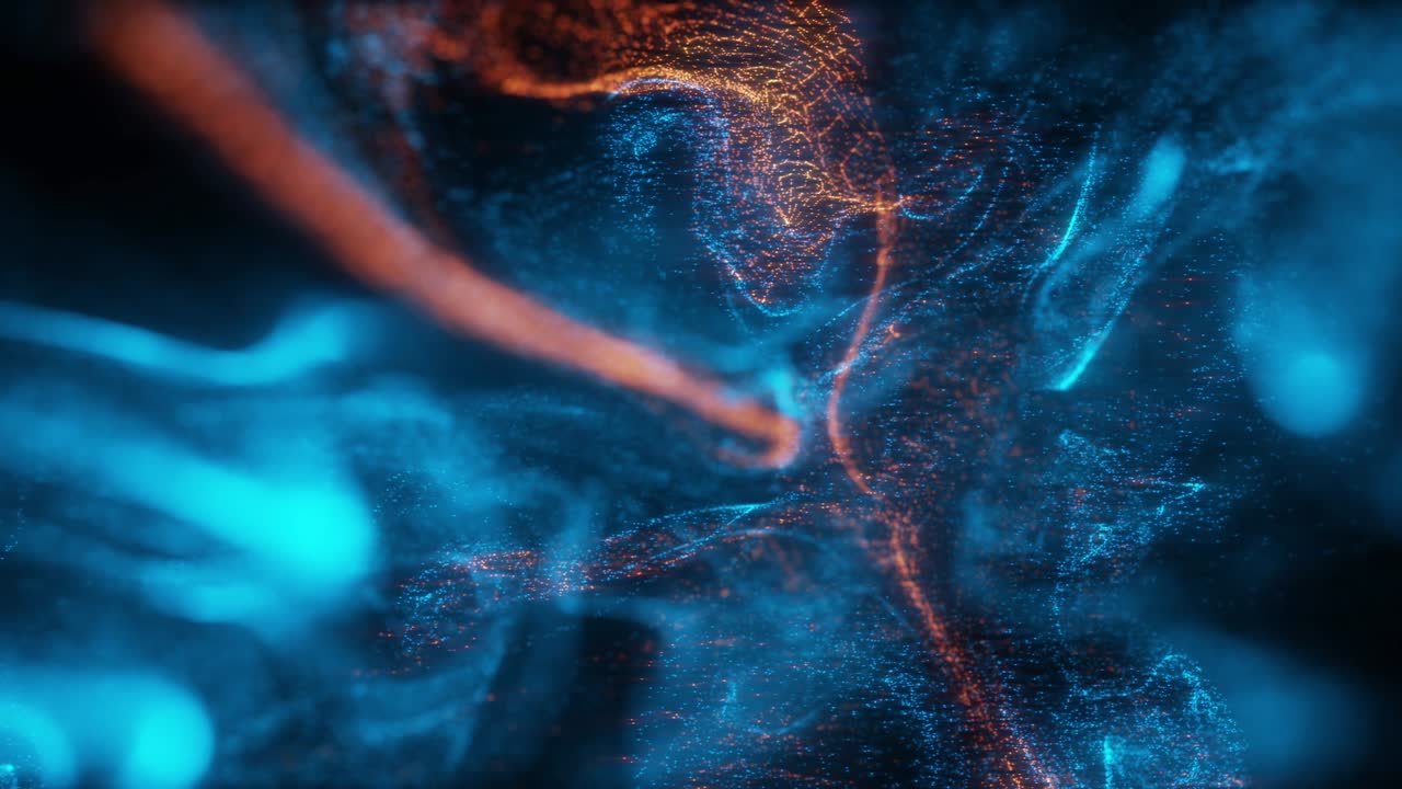 Abstract Macro slow motion shot of Blue and Orange Particle Fluid isolated on black.