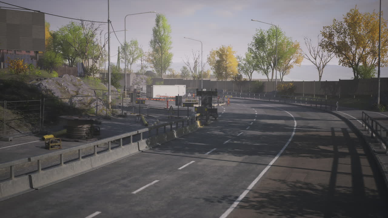 Roadway construction area with equipment and trees in urban environment