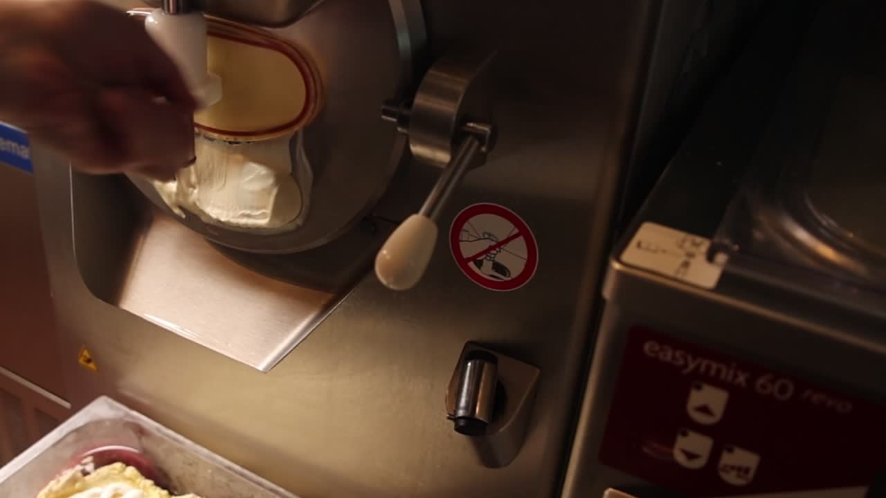 Close-Up of Ice Cream Machine Dispensing Fresh Dessert