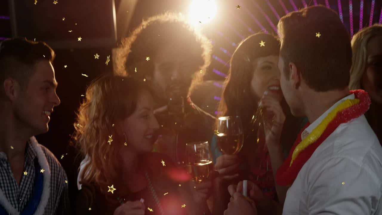 Celebration with friends lifting party horn in bar causing confetti falling and sharing high fives