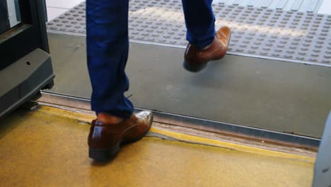 Male-commuter-getting-out-from-the-bus-4k