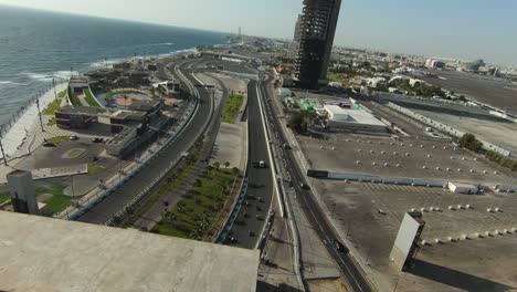 4k drone flyover colorful artistic grand prix supercross formula 1 urban beachside circuit, jeddah saudi arabia 2023