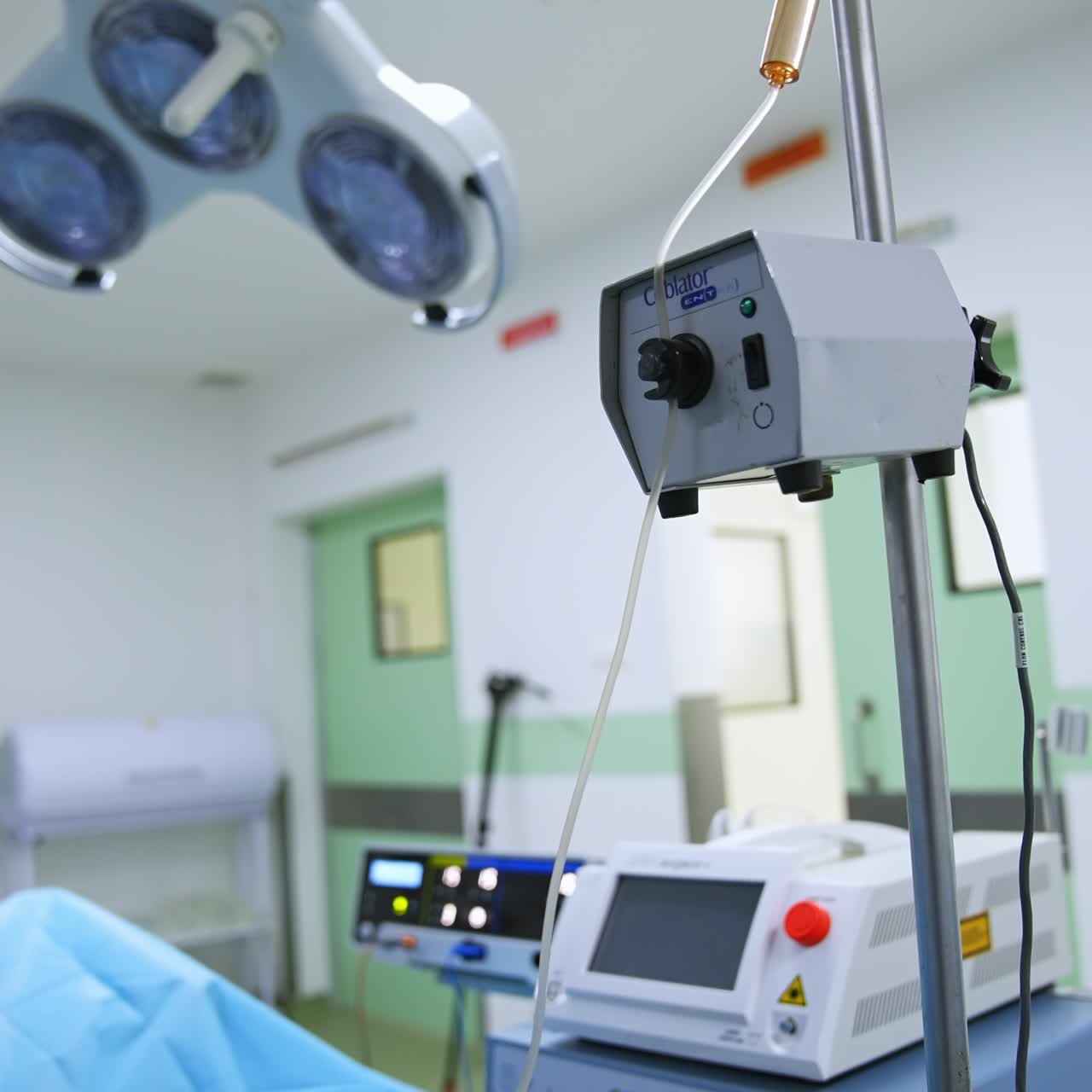 Vertical Screen: Drop counter and other modern technological equipment in the surgery room. Diverse apparatuses switched on during operation