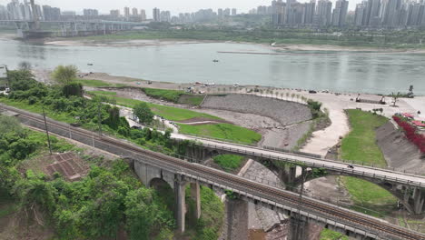 a girl is riding a small motorcycle on an ancient bridge