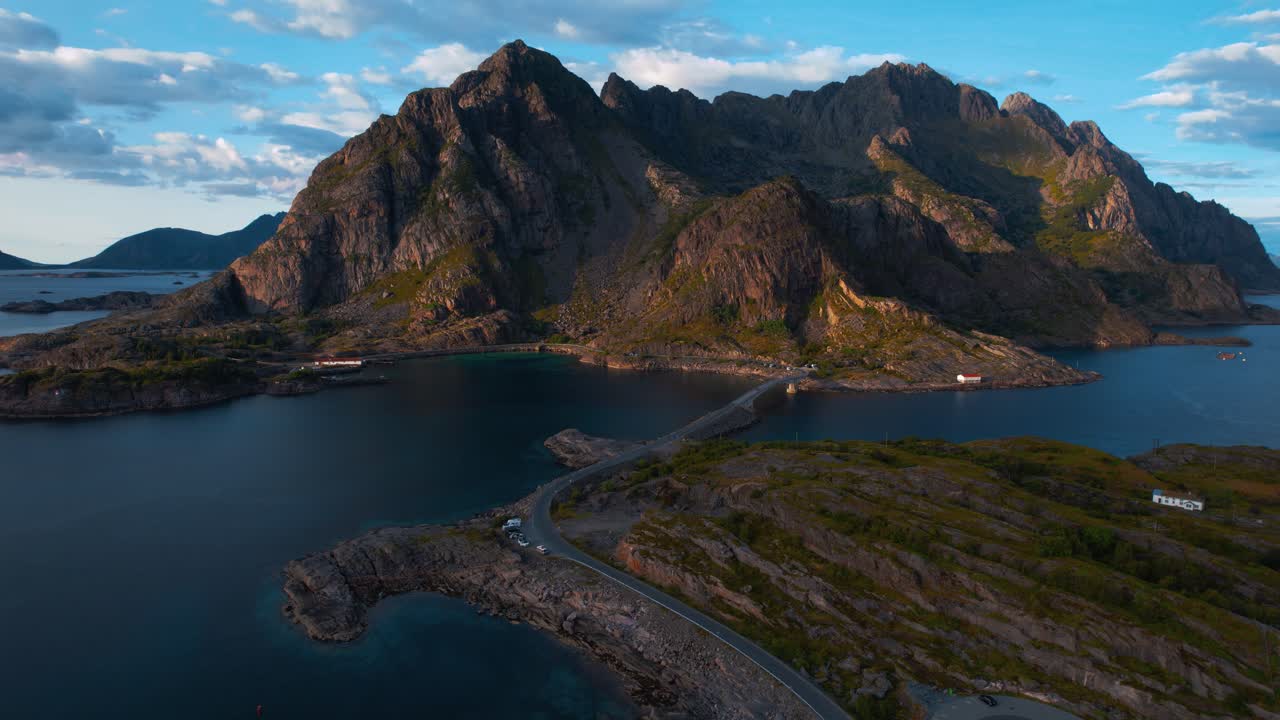 Lofoten, Norway. Scenic aerial of rocky sea landscape with massive green alpine mountain formations.
