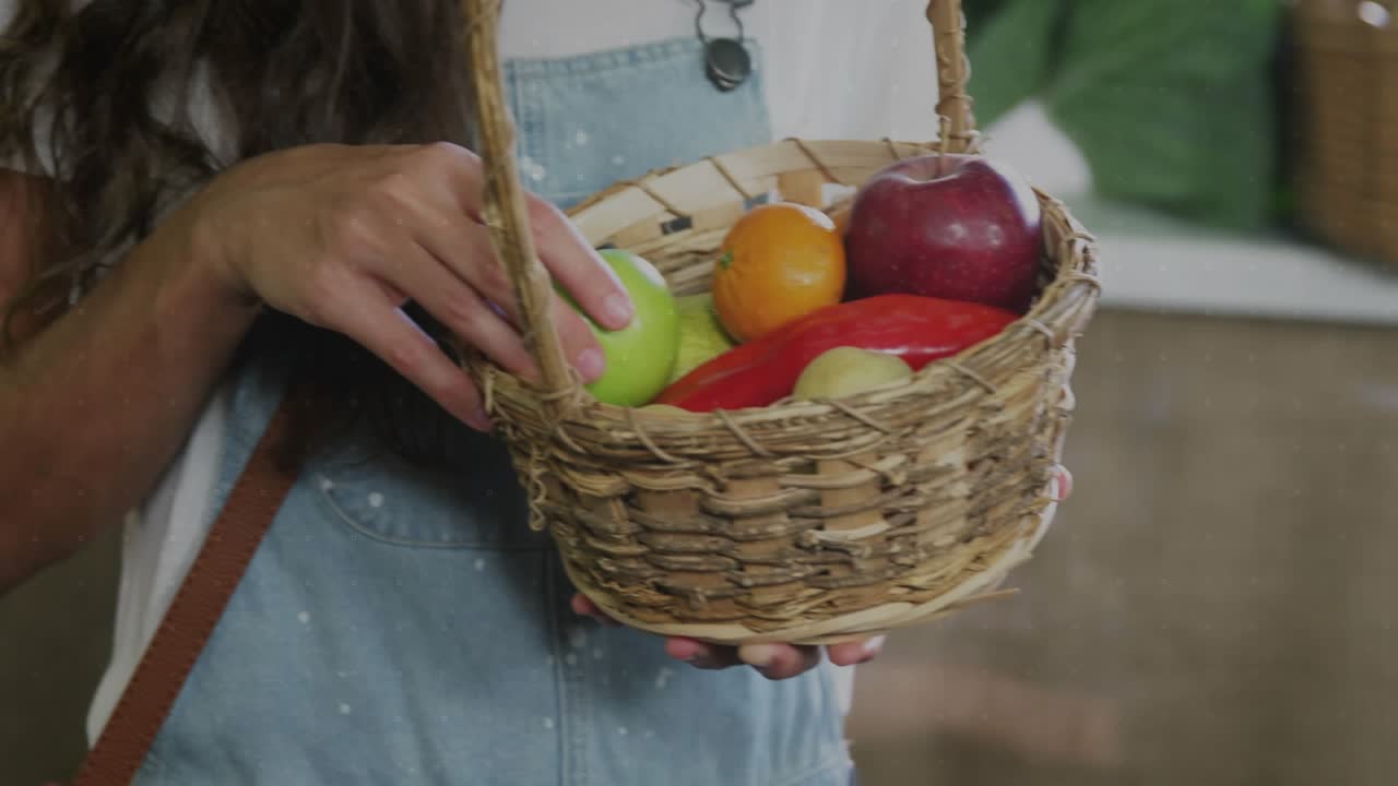 Woman reaching market, picking green apple, judging ripeness while animated charts overlaying face