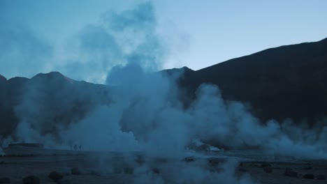 active geyser field on the top of mountain in desert morning medium shot