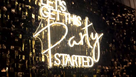 Neon-Sign,-Lets-Get-This-Party-Started,-Wedding-reception,-Slow-Motion