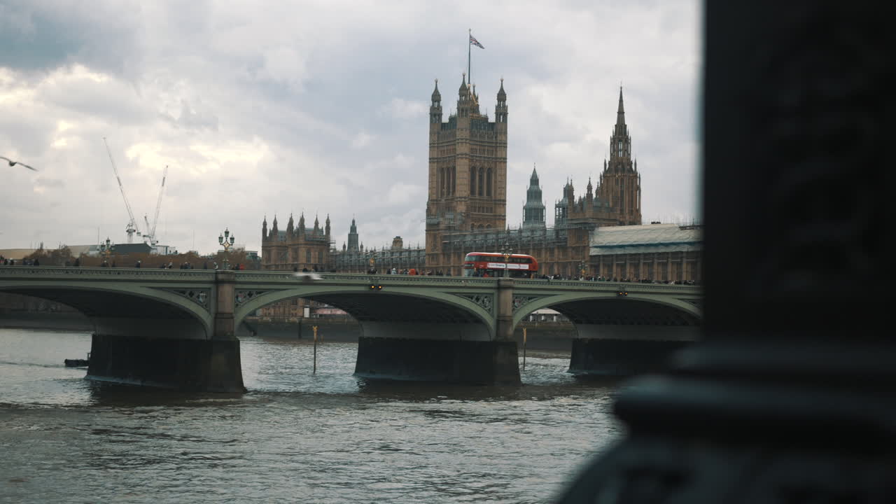 Cinematic reveal of Westminster Palace Victoria Tower British Parliament and River Thames