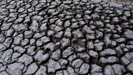 dramatic geometric shapes formed in dried up mud of a river